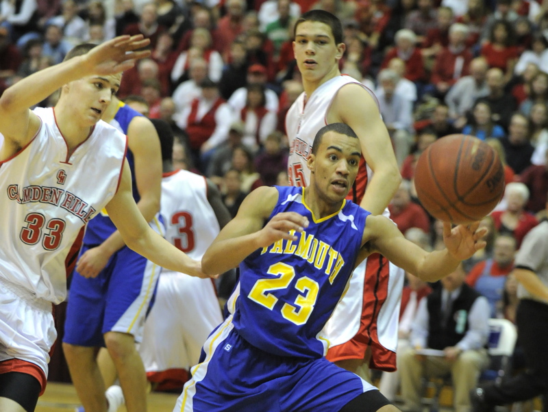 Jahrel Registe of Falmouth chases down a loose ball in front of Keegan Pieri.