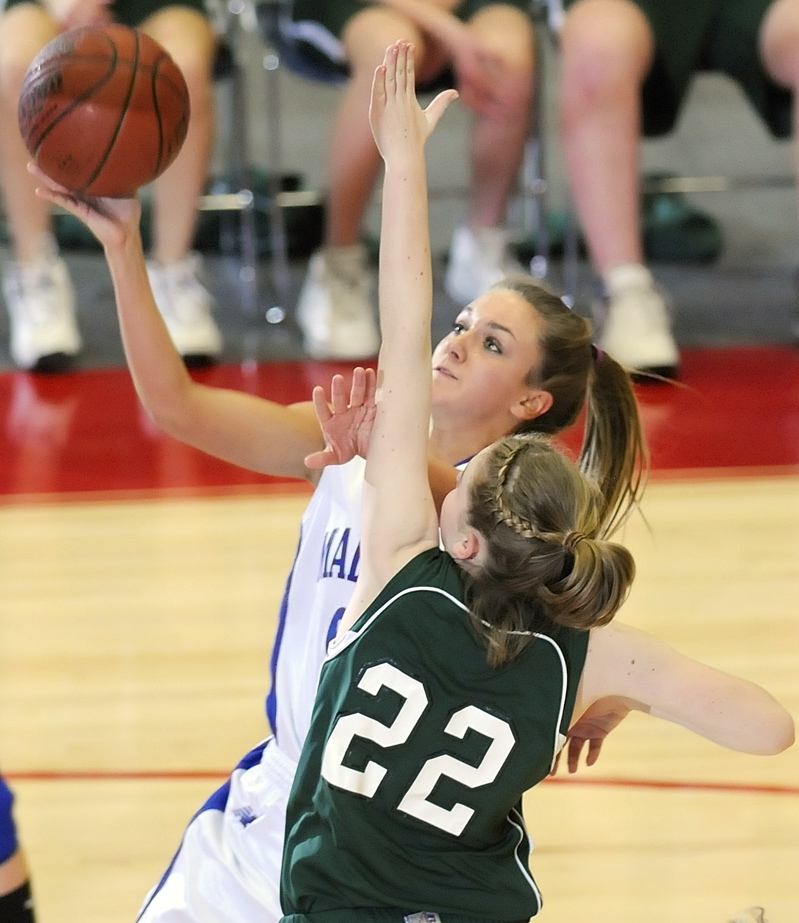 Ali Russell goes up for a shot against Catherine Veroneau.
