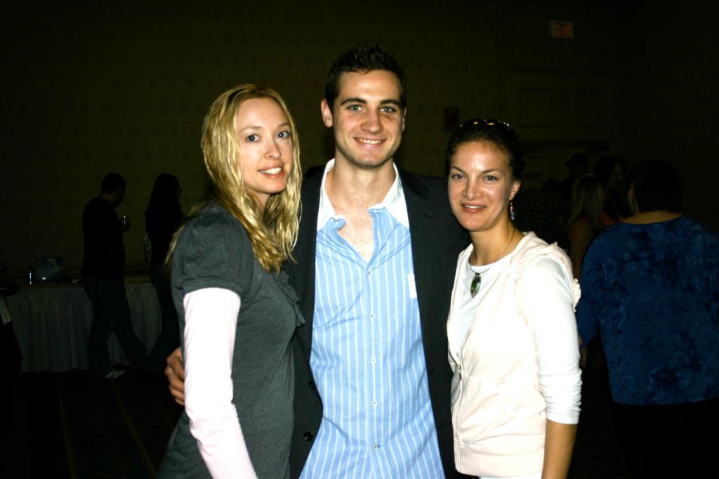 Fans Jaime Richards, of Portland, and Lindsay DiNardo, of Cape Elizabeth, and Pirates player T.J. Brennan.