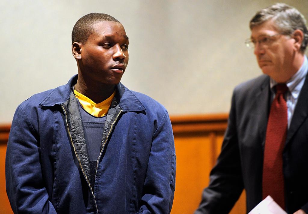 Moses Okot, 21, appears Friday in Cumberland County Superior Court with his temporary attorney, Joel Vincent. A police affidavit alleges that when Daudoit Butsitsi, 24, shot Serge Mulongo on Feb. 10 in Portland, Okot was the getaway driver and provided the shooter with latex gloves.