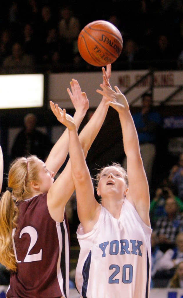 Nicole Taylor of York puts up a shot against Abby Young.