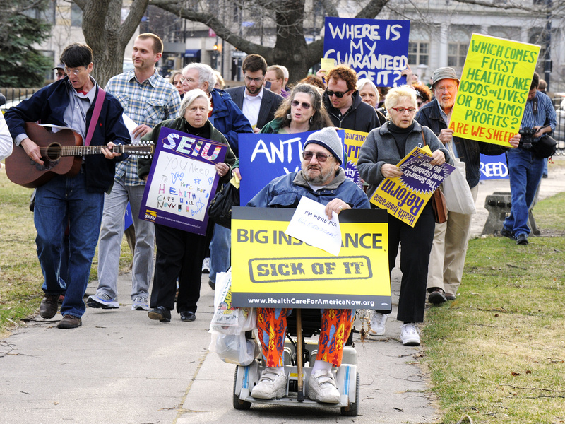 Protesters march into Portland's Lincoln Park to protest Anthem Blue Cross and Blue Shield's effort to overturn a state decision limiting health insurance rates.