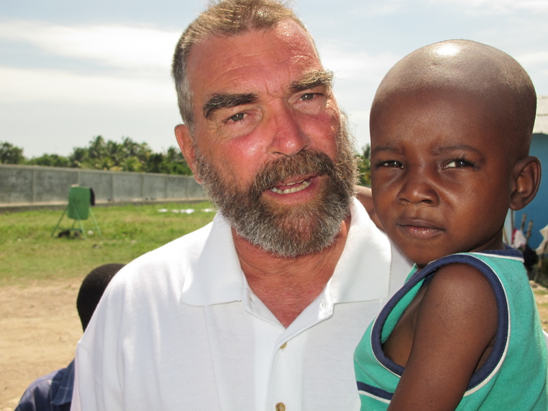 The Rev. Marc Boisvert holds Stanley Toussiant, one of almost 800 orphans who live at Hope Village in Haiti. Boisvert, a Lewiston native, founded and operates the orphanage and community assistance program on the outskirts of Les Cayes.