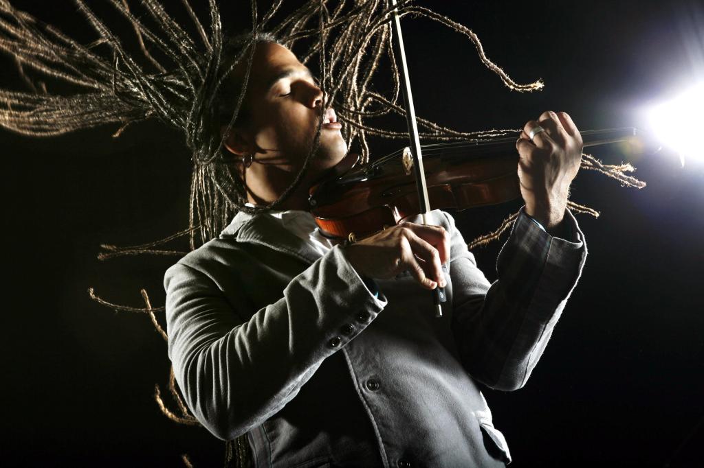 Violinist Daniel Bernard Roumain performs with his quartet and student musicians from Maine on Sunday at the Rockport Opera House.