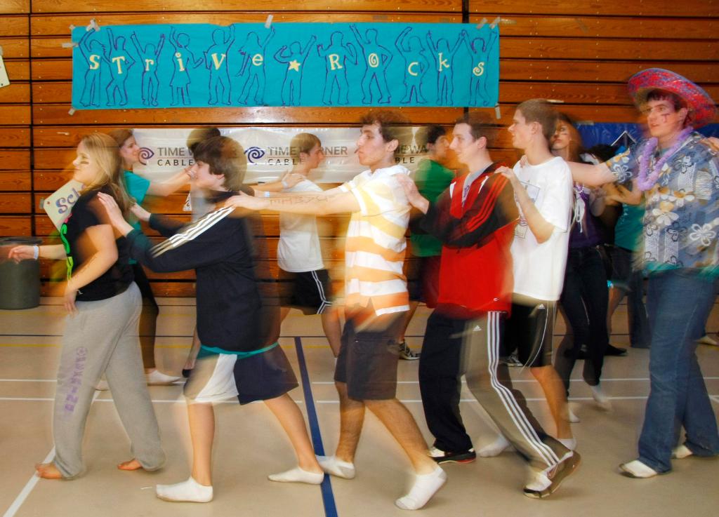 Dancers form a conga line during the final minutes of the STRIVE dance marathon Sunday.