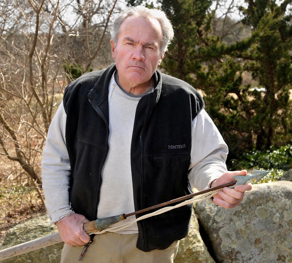 David Linney of Cape Neddick holds a harpoon tipped with a white bronze dart that he uses to catch bluefin tuna off the coast of Maine. He says proposed regulations will cut into his livelihood.