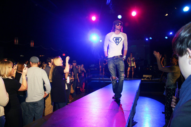 Zerin Whyte models a sand and white Super G baseball shirt.