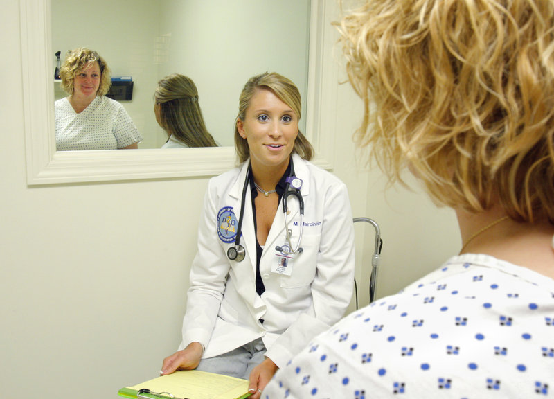 First-year medical student Meredith Marcincin is evaluated by stand-in patient Heidi Conner after a mock physical Thursday at the University of New England in Biddeford. Maine’s supply of primary care doctors has been tightening for years.