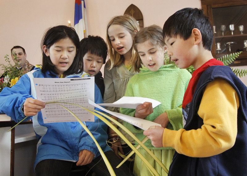 Children sing during the Palm Sunday service at First Congregational. They are, from left, Jade and Mimi MacKilligan of Kennebunkport, Patti Mankin of Arundel and Molly Burne and Zak Burgess, both of Kennebunkport.