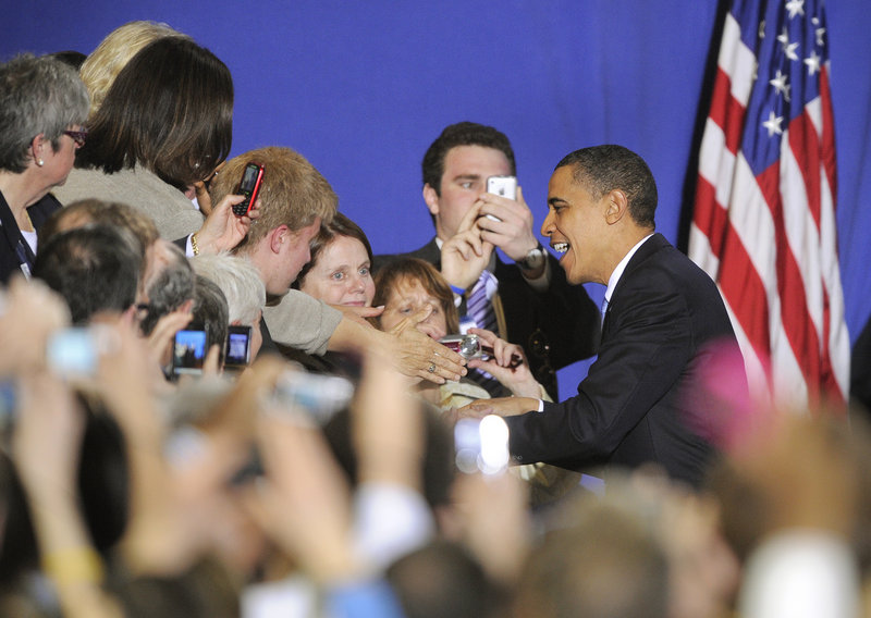 President Obama arrives Thursday for his appearance at the Portland Expo. The crowd of more than 2,000 people roared and waved when the president entered, and later drowned out parts of his speech with applause and cheers.