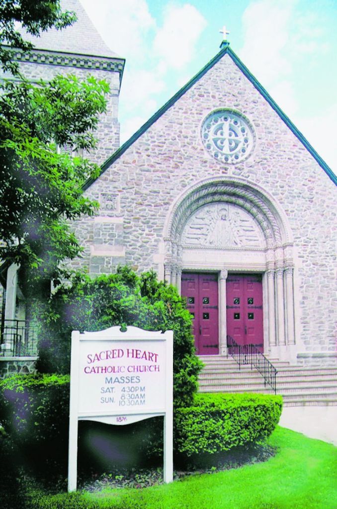 Sacred Heart Church, built in the grand Romanesque style by master stonemason Charles Knight Sr.