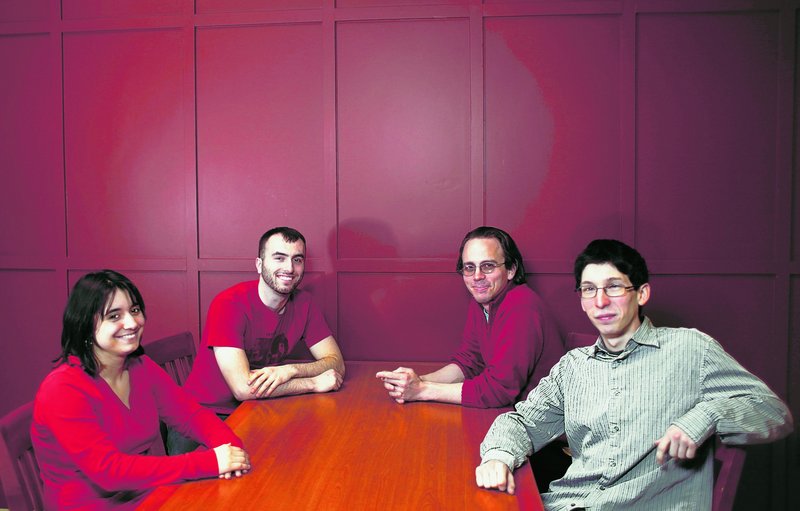 Katie Panger, left, founder, Brett Jacobson, president, Thomas Hodges and Jonathan Guca are seen before a meeting of the Atheists, Agnostics and Free Thinkers group at Northern Illinois University in DeKalb. There are nearly 200 atheist or agnostic student groups on college campuses in the United States.