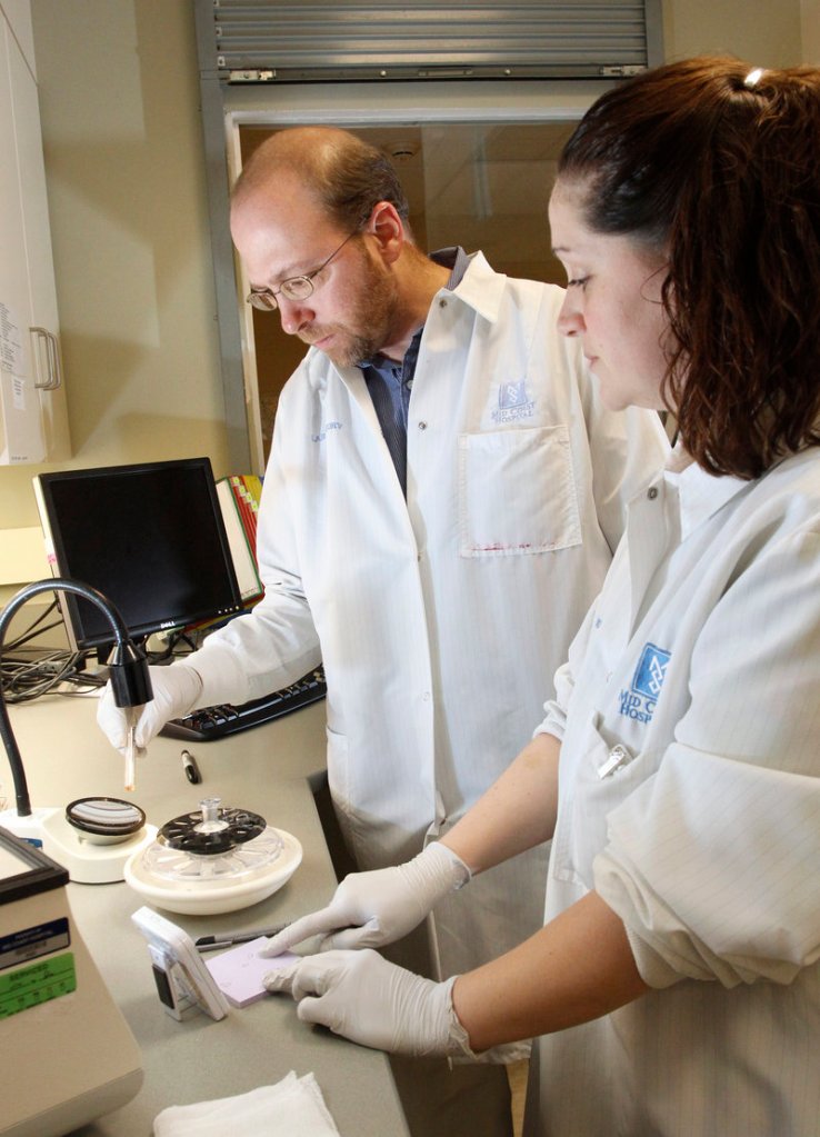 Reporter Ray Routhier shows his steady hand and tests his science prowess while running a test in the lab at Mid Coast Hospital in Brunswick, under the guidance of Kate Cote, a medical laboratory technician.