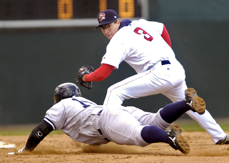 Portland's Nate Spears tags out Trenton's Austin Romine at second base Sunday afternoon at Hadlock Field. The Sea Dogs split their doubleheader with the Thunder, losing the opener 3-1 before winning the second game, 2-1.