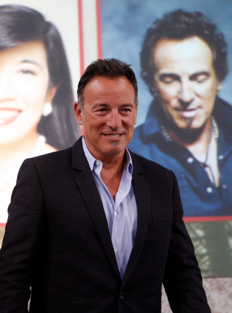 Bruce Springsteen stands on stage after being honored at the Ellis Island Family Heritage Awards Thursday on Ellis Island in New York.