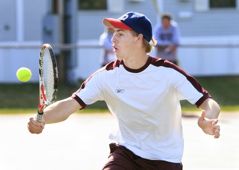 Kurt Stultz of Windham returns a shot Monday during a doubles match at Scarborough. Stultz and partner Nick Rallis beat Zach Porter and Dennis Liu, 6-3, 6-2.