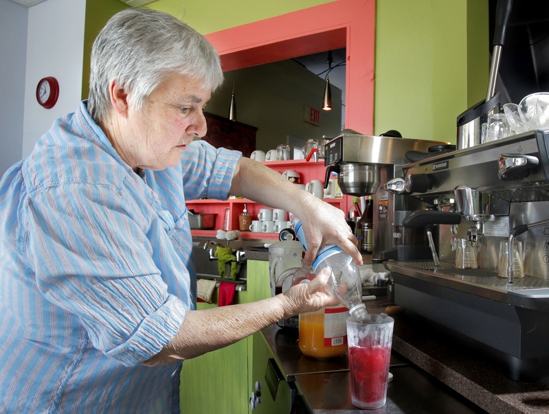 Jo Moser makes a pomegranate spritzer at her Greenlight Studio.