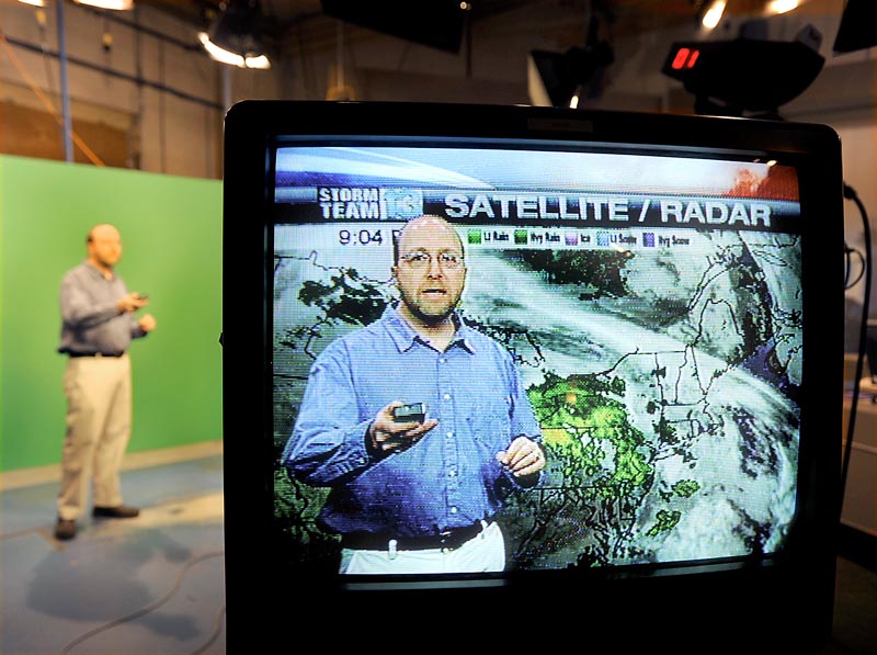 Ray Routhier, a reporter for The Portland Press Herald, works with WGME-TV meteorologist Charlie Lopresti, who helped Routhier prepare to present the weather segment. Lopresti said to avoid using jargon and to instead focus on how the forecast might affect the viewers’ day.