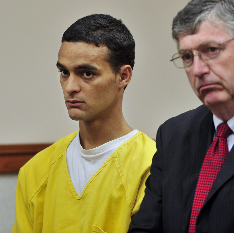 William Googins, left, stands with attorney Joel Vincent in Portland District Court on Wednesday as Googins is asked by Judge Paul Eggert if he understands the charges against him. Googins is accused of manslaughter in the death of Eric Benson after a confrontation in Monument Square early Sunday.