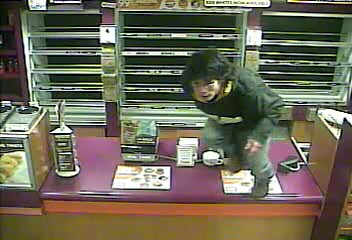 Photo of burglary suspect from surveillance camera.