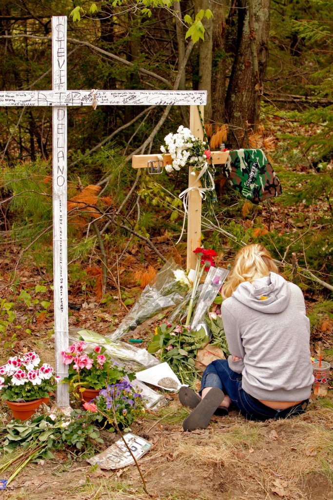 Scarborough High senior Brittany Hershberger grieves at the site of the car crash in Scarborough that killed senior Steven Delano and injured three other teenagers Saturday night.