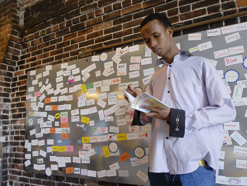 Rabiic Gedi, 17, of Portland High School reads his piece, “Lemon Stew,” from “Can I Call You Cheesecake? 35 Stories & Poems About Food,” an anthology that is the fruit of a writing exercise led by the Telling Room in Portland.