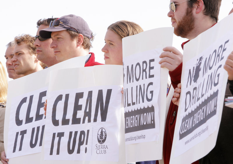 As oil from a massive spill continues to gush into Gulf of Mexico, demonstrators gathered at East End Beach in Portland on Wednesday to voice their opposition to offshore oil drilling. The protest included members of the Maine chapter of the Sierra Club, members of Repower Maine, as well as representatives of the state's fishing and ocean-related tourism industries. Holding signs, from right, are Andrew Kain, Sarah Adams Bigney and Greg Brown.