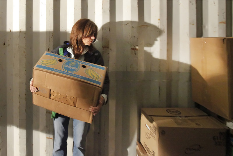 Jennifer Hickey of Falmouth lends a hand with the supplies bound for Haiti. Hickey is with Partners for World Health, a Portland group that donates medical goods to organizations around the world.