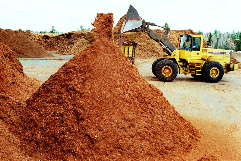 Piles of mulch at P.R. Russell Inc. in Richmond, which supplies different types of mulch throughout New England.