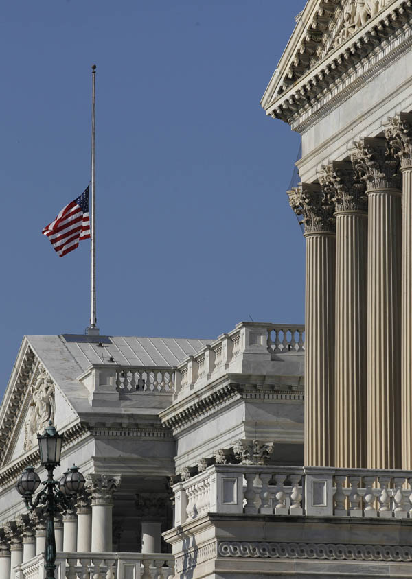 The flag over the U.S. Capitol flies at half staff in honor of the passing of Sen. Robert C. Byrd in Washington today.