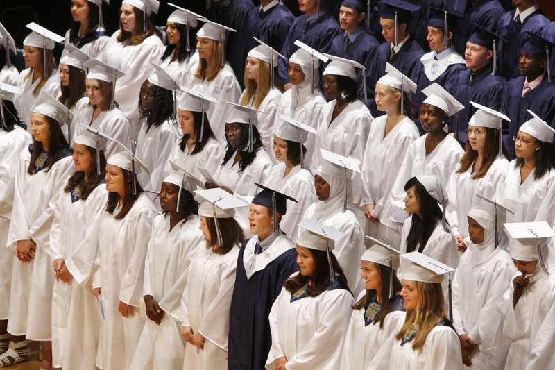 Portland High School seniors sing during their graduation ceremony at Merrill Audiorium in Portland on Wednesday.