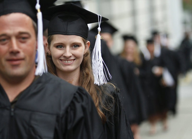 Elizabeth Robinson walks with her classmates during the Portland Adult Education graduation ceremonies Thursday at Merrill Auditorium in Portland. Robinson received a high school equivalency diploma.