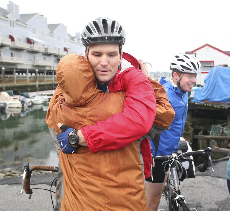 Joel Glover hugs his mother, Jane, goodbye before leaving Portland on Sunday. He and two fellow veterans plan to raise $250,000 for a nonprofit that aids wounded service members.