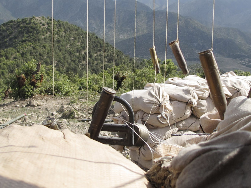 A wind chime made of spent shell casings adds a touch of wartime decoration to a mountaintop observation post manned by the Maine Army National Guard's Bravo Company, 3rd Battalion, 172nd Infantry.