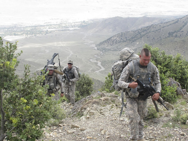 Front to rear, Spc. Peter Donovan of Lisbon Falls, Sgt. Frederick Moody of Gorham and 1st Sgt. John Brooks of Glenburn climb to an observation post manned by Bravo Company, 3rd Battalion, 172nd Infantry.