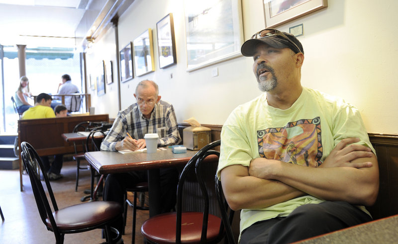 Eric Thomas, seen at Jorgensen’s Cafe in Waterville, is the Colby College band director. He’s not convinced Lepage’s blunt style will be effective, he said, because some complex issues “need subtlety.”