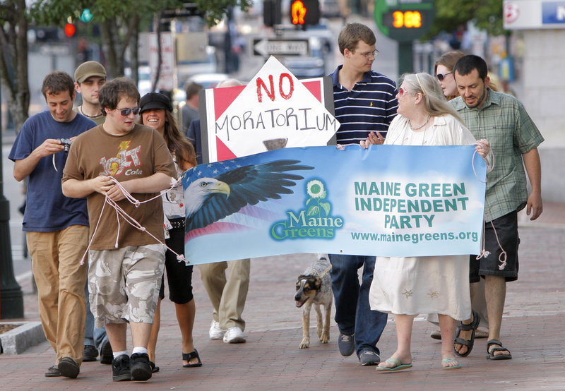 Demonstrators opposing a proposed moratorium on medical marijuana dispensaries in Portland march down Congress Street to Portland City Hall on Monday. Critics urged councilors not to stand in the way of helping patients who need access to the drug.