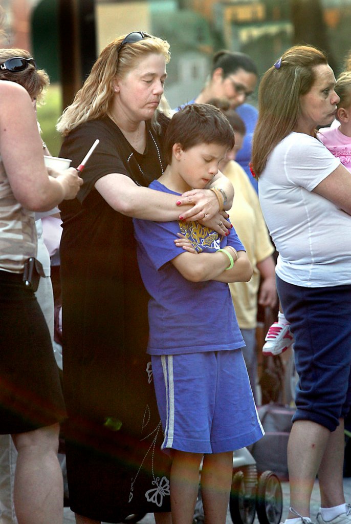 Lorraine Ela holds her great-nephew Nathan Nadeau. Megan Waterman has been missing since June 5, when she was last seen at a hotel in Hauppage, New York.