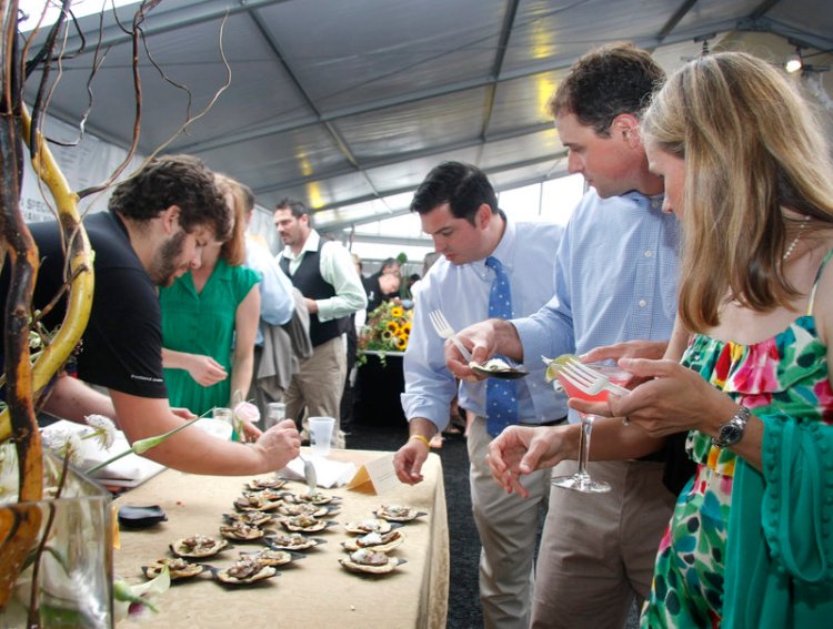 Chef Andrew Taylor of Hugo’s in Portland serves Gedalis Farm goat taquitos at Taste of the Nation’s Share Our Strength benefit in Portland in 2014. The fundraising event returns this year.