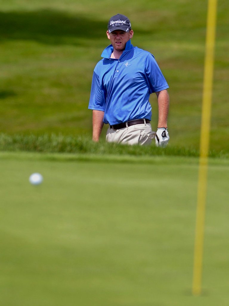 Shawn Warren, a former Maine Open champion, watches his chip shot roll toward the pin to set up a birdie putt. Warren shot 70 in Round 1 of the Portland/Maine Open.