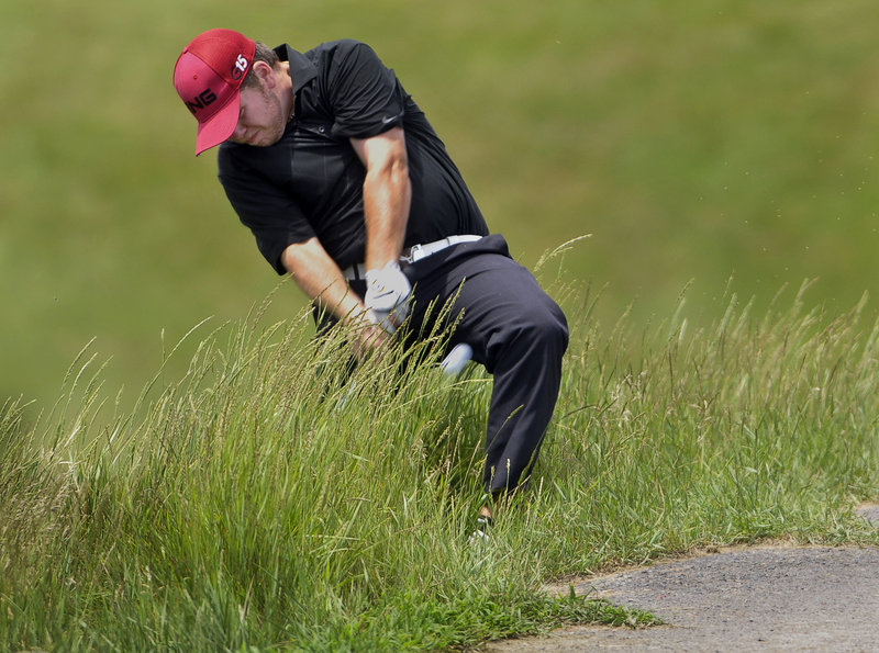 Ryan Gay, a past Maine Amateur champion from Pittston, hits out of deep rough to the 16th green Tuesday in the first round of the Charlie’s Portland/Maine Open at Riverside Golf Course. Gay finished with a 73.