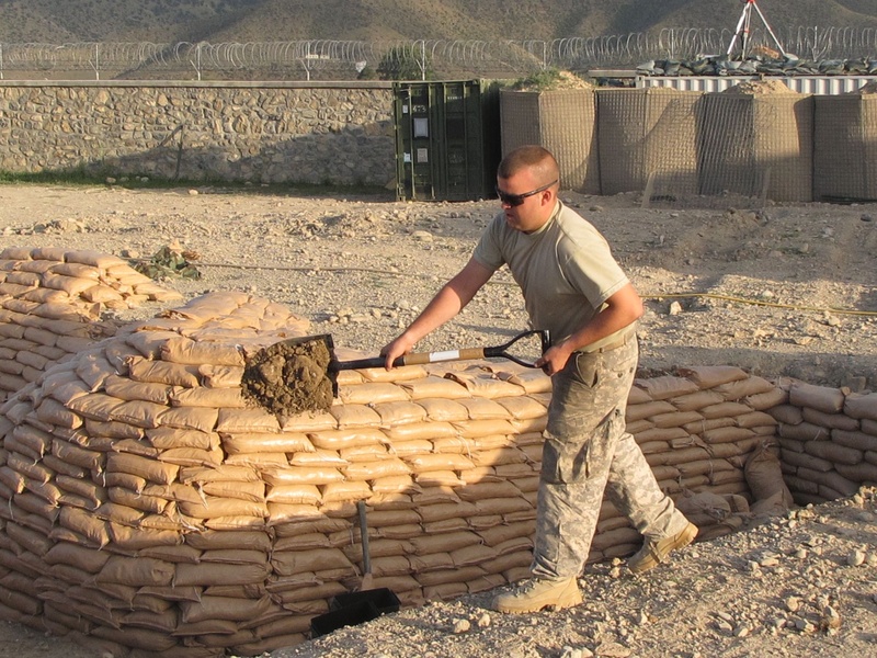 Bravo Company Spc. Mike Desjardins of Berwick works on fortifications Friday at Combat Outpost Dand wa Patan in Afghanistan.