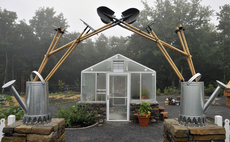 Giant watering cans, rakes, shovels and hoes form the entrance to the interactive Learning Garden.