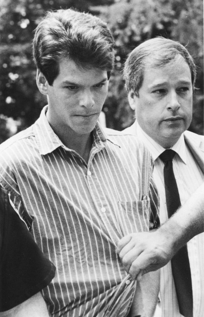 Thirty-year-old Dennis Dechaine of Bowdoinham is escorted to his arraignment in the slaying of 12-year-old Sarah Cherry on July 12, 1988, four days after his arrest. Dechaine has been in custody since.