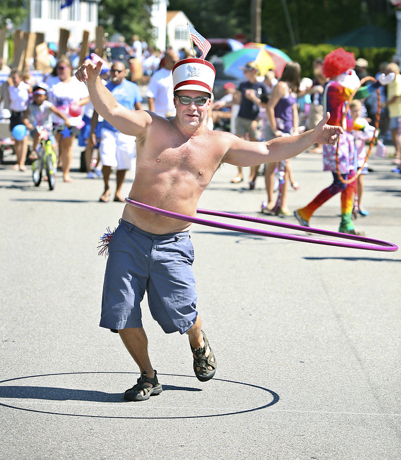 Scott Belanger of Ocean Park shows off his hula hoop skills with the group Hoopsters during the 60th annual Independence Day Community Parade in Ocean Park on Monday.