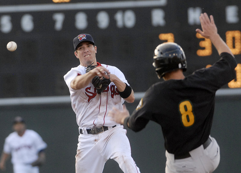 Sea Dogs second baseman Nate Spears gets the throw away past the sliding Brian Jeroloman of the Fisher Cats to complete a double play in the Cats' 8-2 win Thursday night.