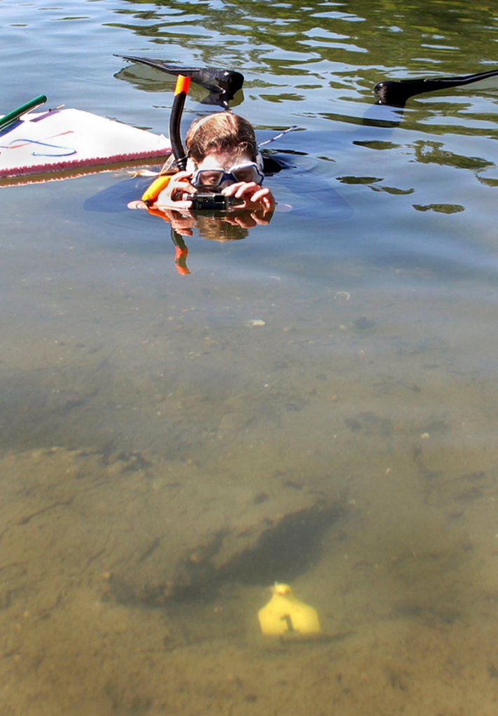 Diane Cowan photographs lobster mating sites, located near the yellow flag, at the conservancy.