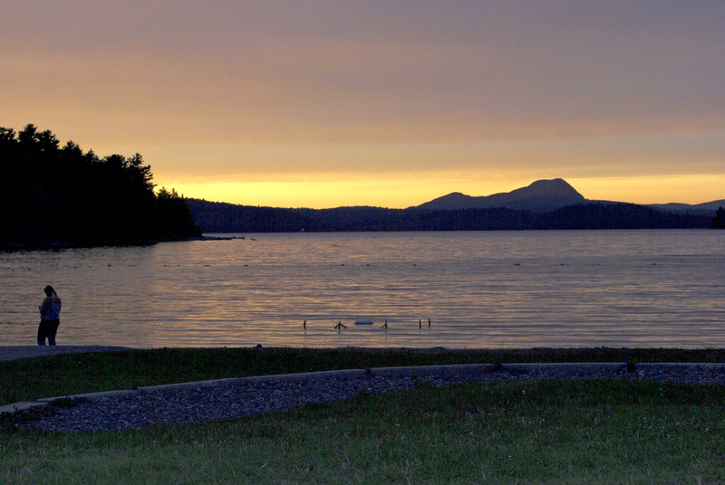 The sun sets behind Borestone Mountain and over Sebec Lake at Peaks-Kenny State Park in Dover-Foxcroft. Park employee Isaac Crabtree said locals regularly drive into the park to see the stunning sunsets.