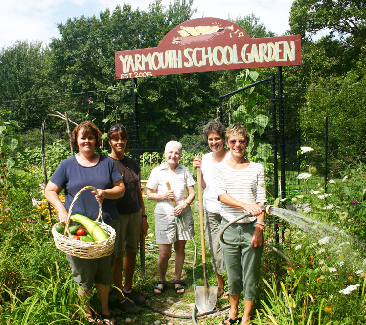 Yarmouth's nutrition director Becki Schreiber, with shovel, stands in the school district's garden with her coordinators, from left, Bertha Voss, who heads the high school kitchen, Barbara Pride, who handles the Rowe School kitchen, Linda Armstrong, who coordinates the middle school kitchen, and Susan Stowell, who heads the elementary school kitchen, where the garden is located.