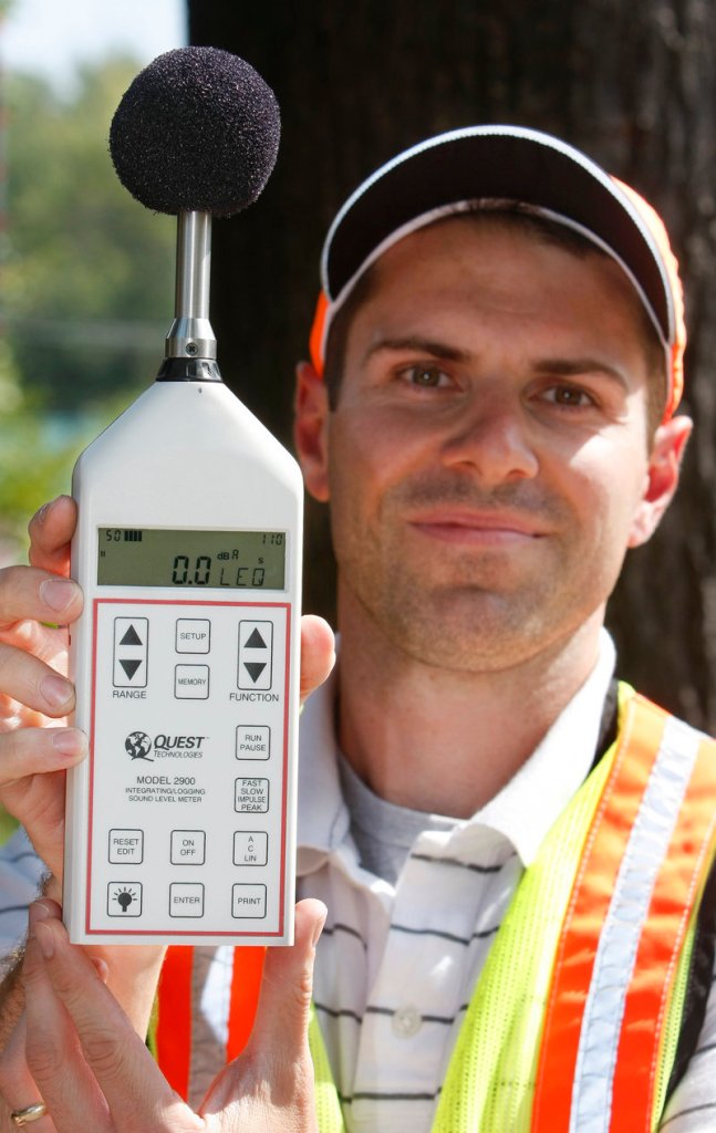 Howard shows the sound-level meter he used Wednesday to take readings near the sound barrier.